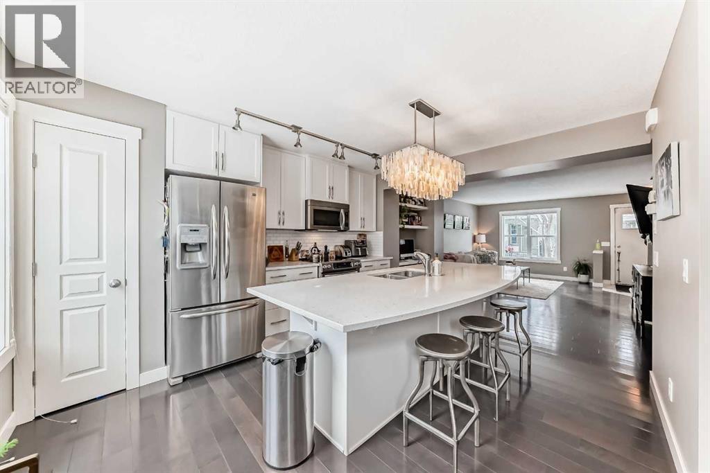 105 Mckenzie Towne Square Se, Calgary, AB - Indoor Photo Showing Kitchen With Stainless Steel Kitchen With Double Sink With Upgraded Kitchen