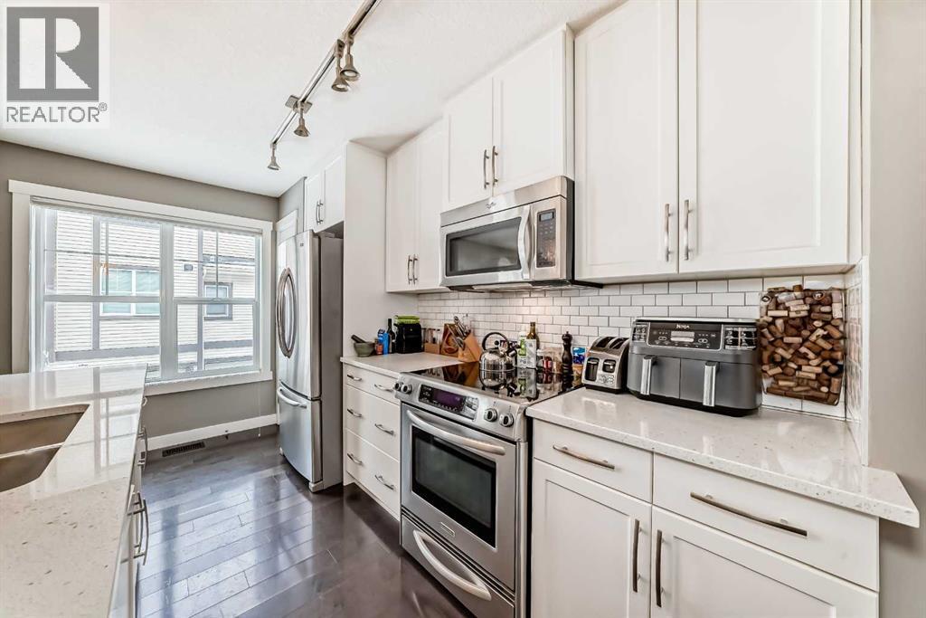 105 Mckenzie Towne Square Se, Calgary, AB - Indoor Photo Showing Kitchen With Stainless Steel Kitchen With Upgraded Kitchen