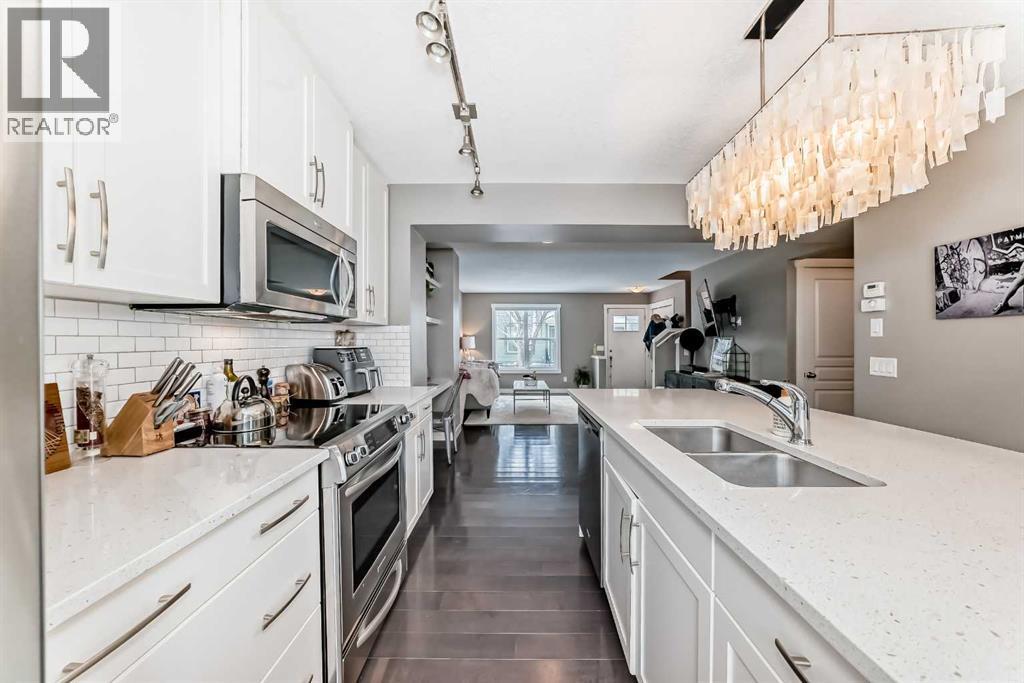 105 Mckenzie Towne Square Se, Calgary, AB - Indoor Photo Showing Kitchen With Double Sink With Upgraded Kitchen