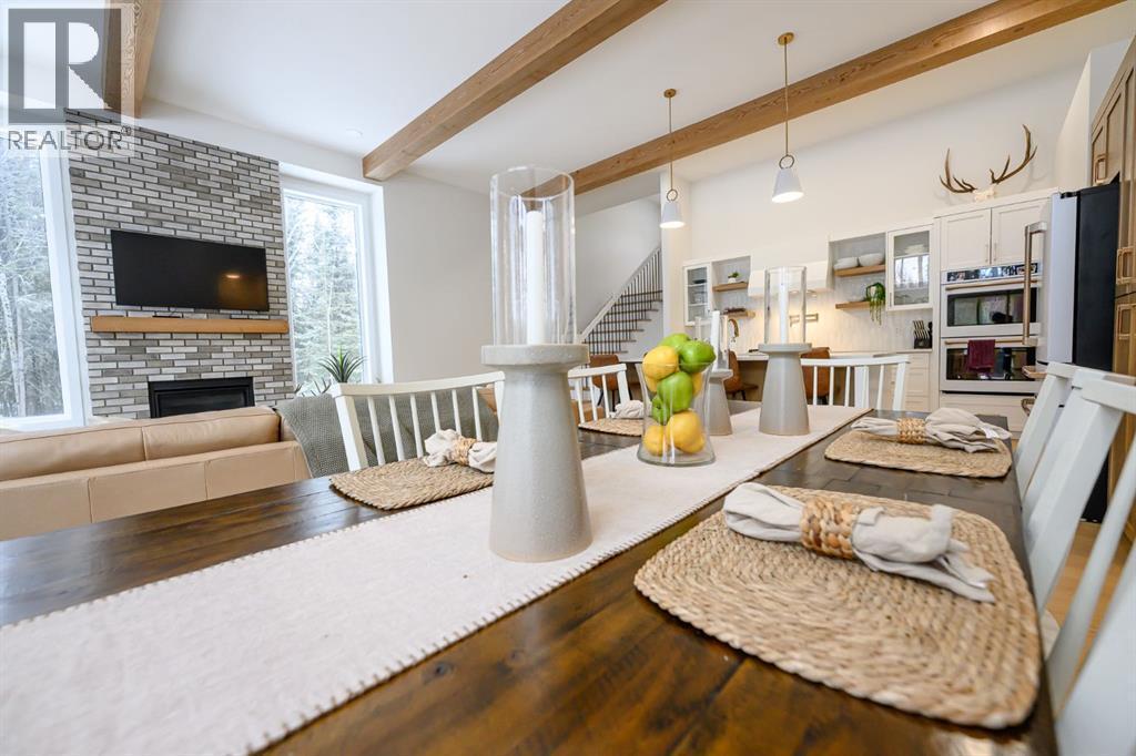 57-704010 64 Range Road, Rural Grande Prairie No. 1, County Of, AB - Indoor Photo Showing Dining Room With Fireplace