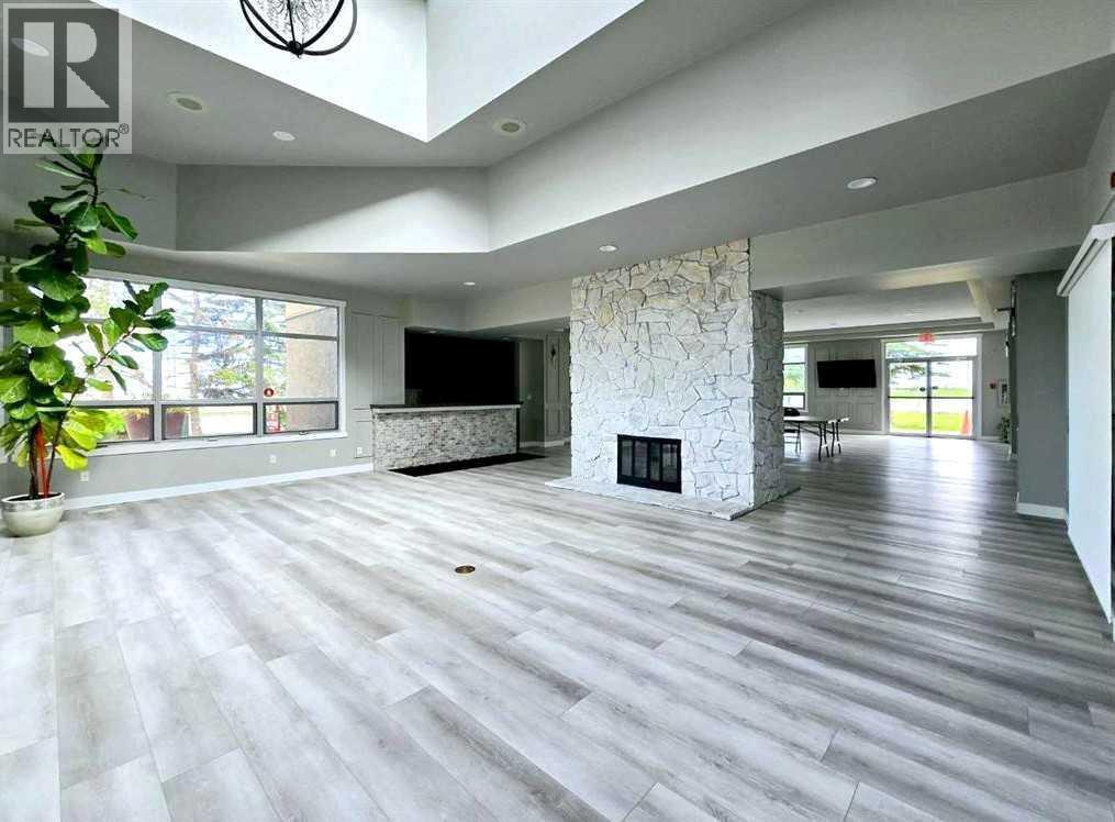 1, 101 Village Heights Sw, Calgary, AB - Indoor With Fireplace