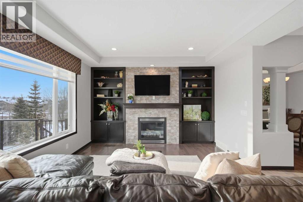 71 Panatella View Nw, Calgary, AB - Indoor Photo Showing Living Room With Fireplace