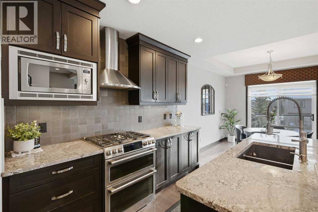 71 Panatella View Nw, Calgary, AB - Indoor Photo Showing Kitchen With Double Sink With Upgraded Kitchen