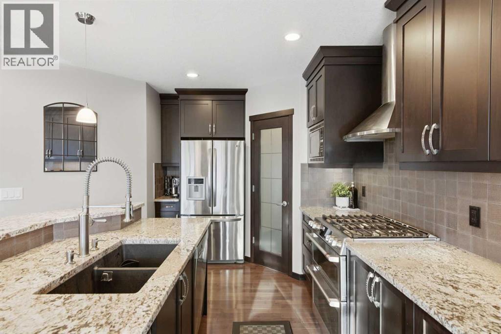 71 Panatella View Nw, Calgary, AB - Indoor Photo Showing Kitchen With Double Sink With Upgraded Kitchen