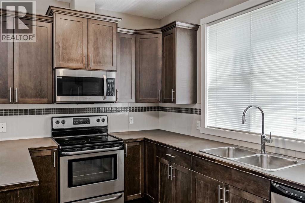 108 Redstone View Ne, Calgary, AB - Indoor Photo Showing Kitchen With Stainless Steel Kitchen With Double Sink