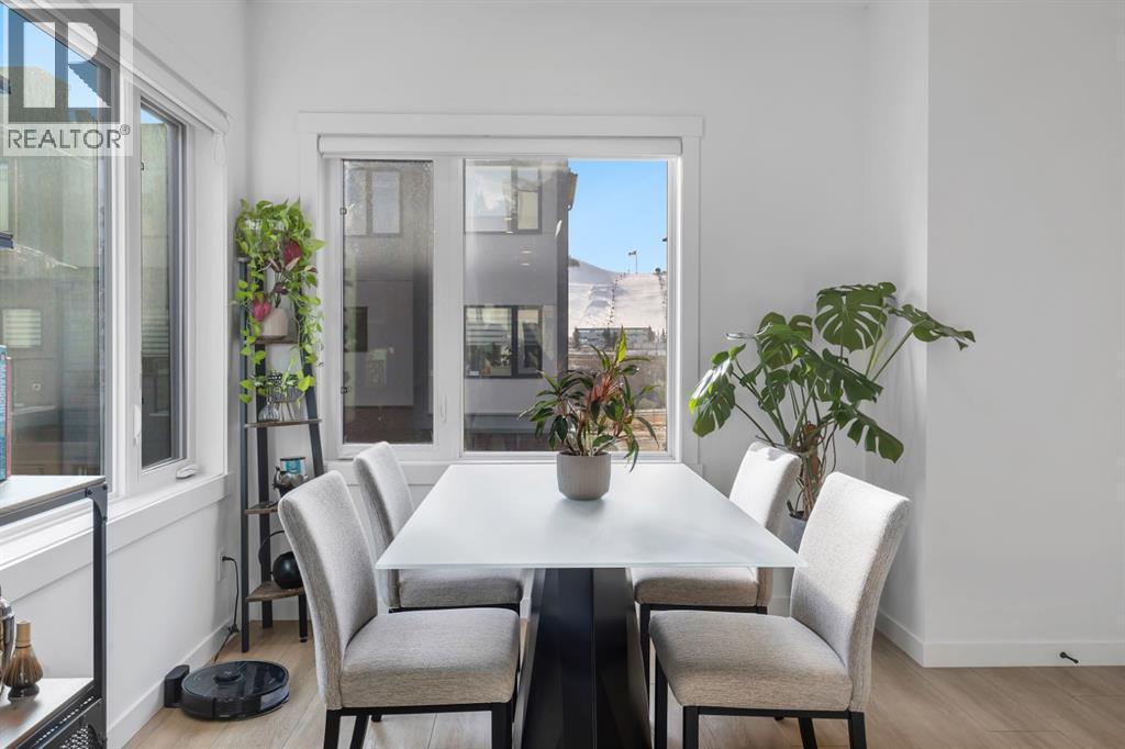 Dining Room with South Exposure - 213 Greenbriar Common Nw, Calgary, AB - Indoor Photo Showing Dining Room