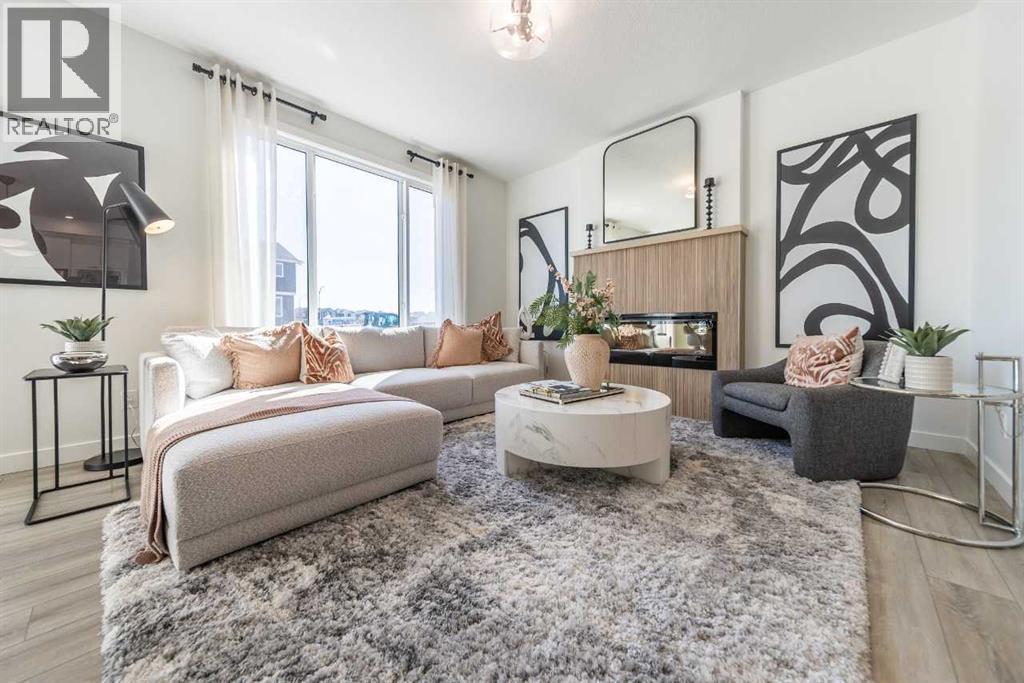 326 Hotchkiss Common Se, Calgary, AB - Indoor Photo Showing Living Room With Fireplace