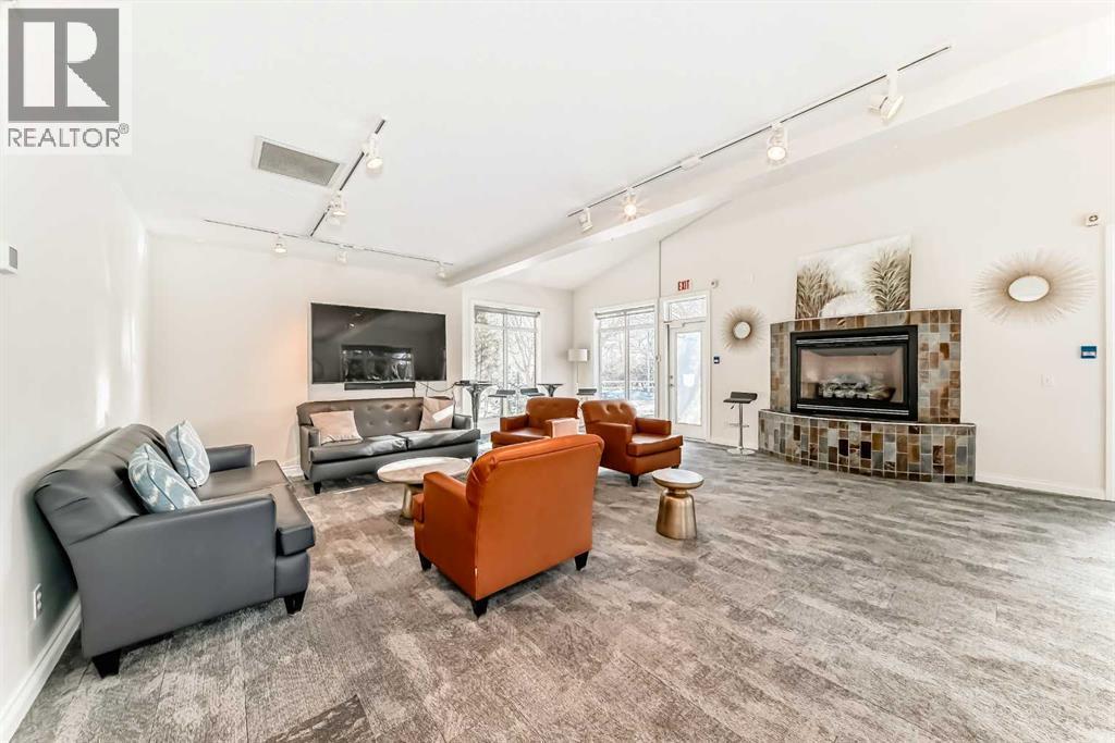 3217, 24 Hemlock Crescent Sw, Calgary, AB - Indoor Photo Showing Living Room With Fireplace
