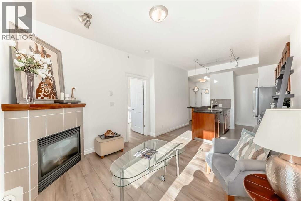 3217, 24 Hemlock Crescent Sw, Calgary, AB - Indoor Photo Showing Living Room With Fireplace