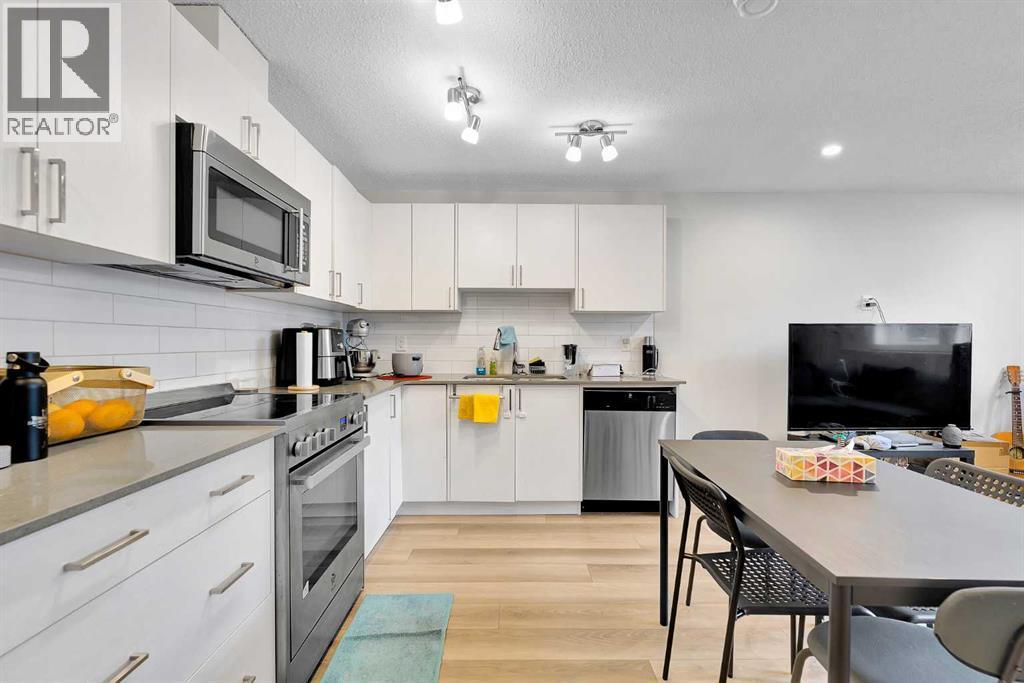 317 Cranbrook Square Se, Calgary, AB - Indoor Photo Showing Kitchen With Upgraded Kitchen