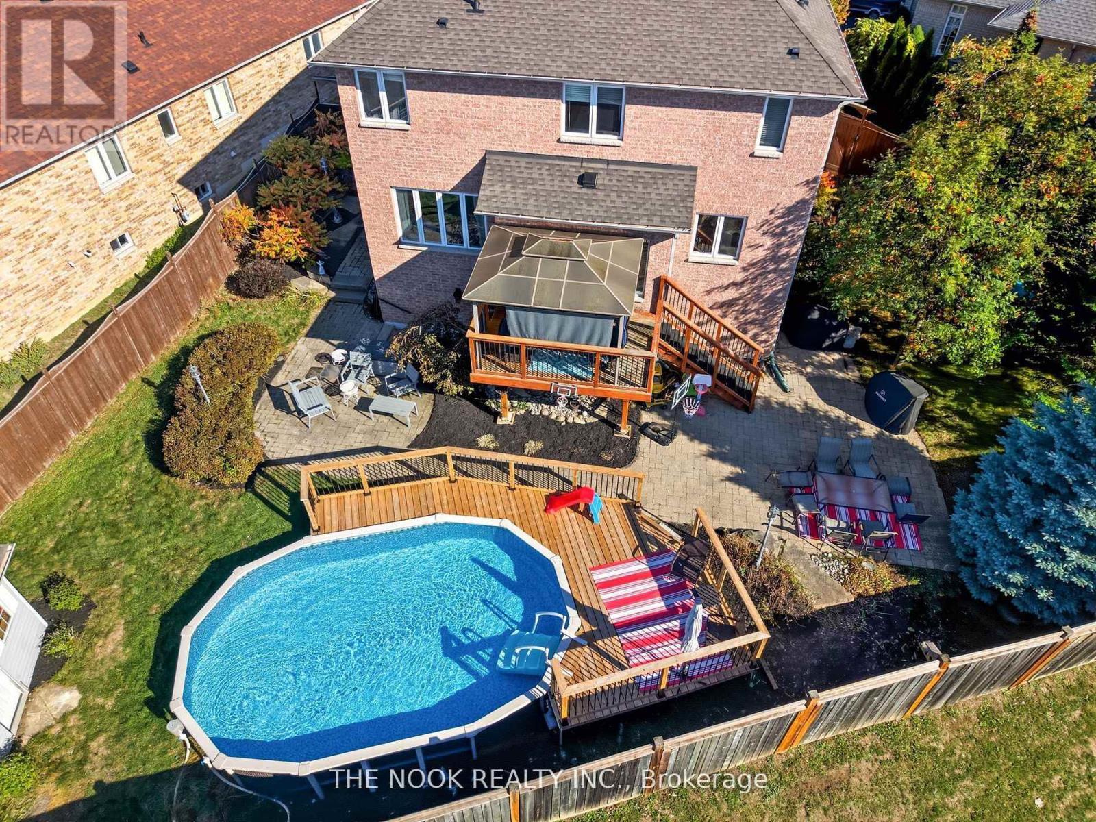 42 Bridle Court, Clarington (Courtice), ON - Outdoor With Above Ground Pool With Deck Patio Veranda