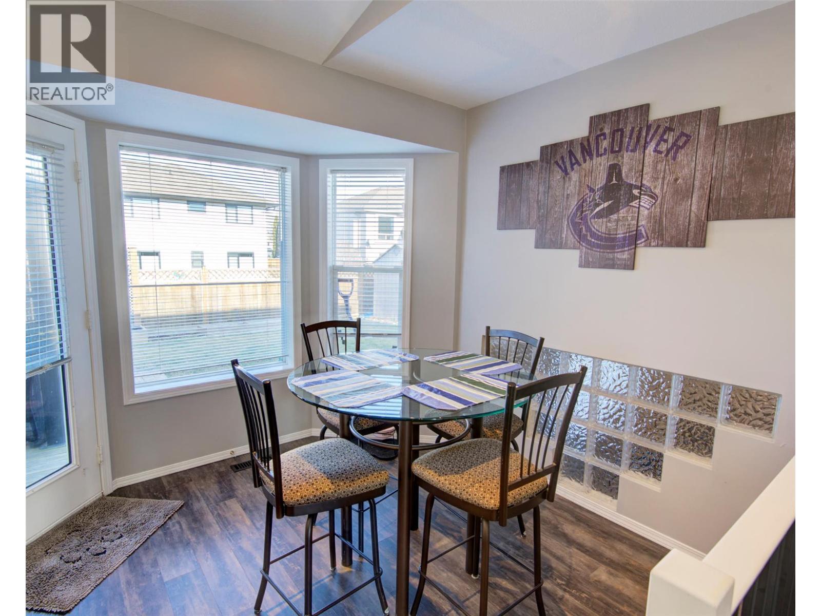 Dining area with access to the back yard - 2312 Hunter Avenue, Armstrong, BC - Indoor Photo Showing Dining Room