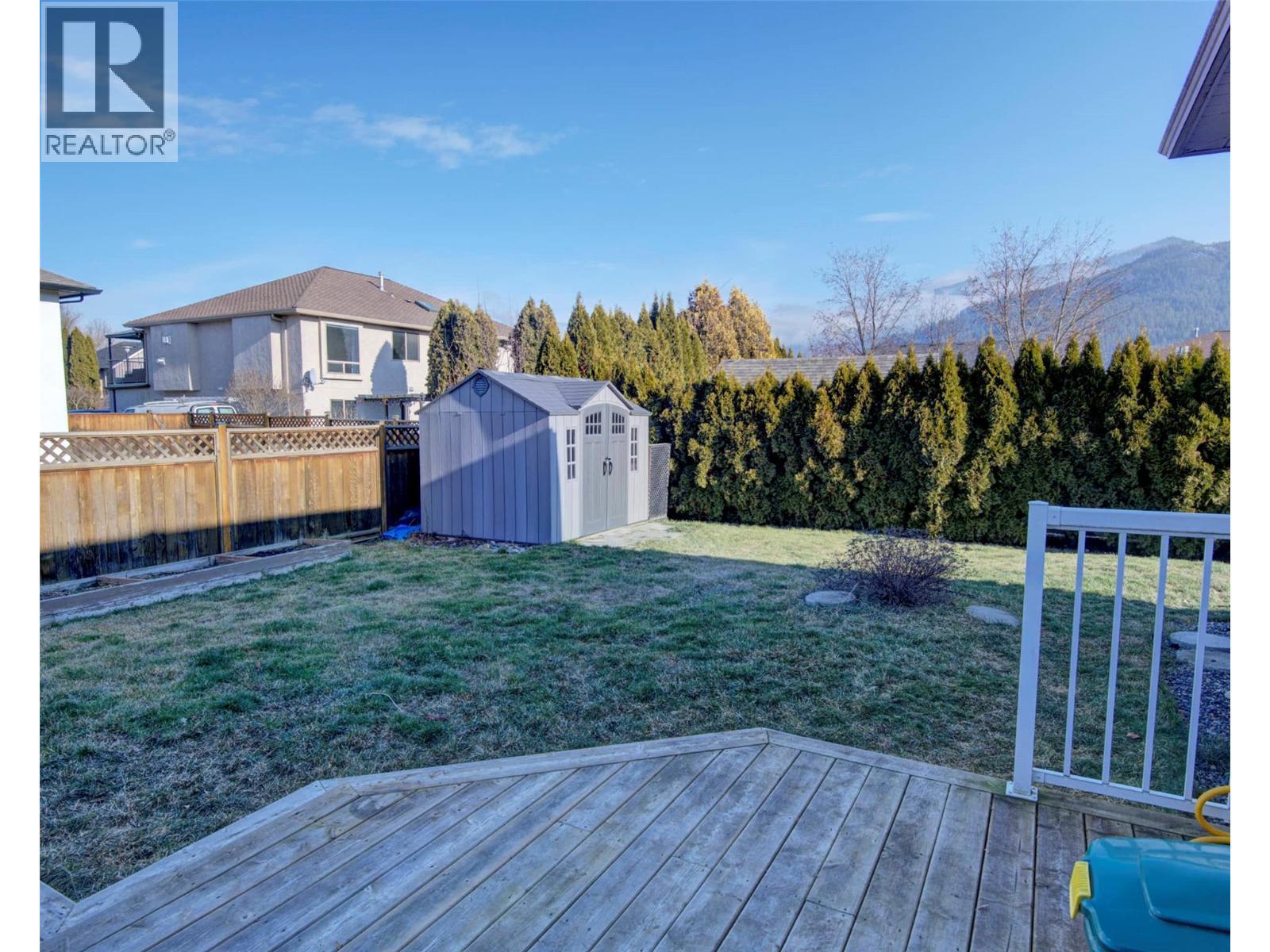 Back yard with 2 storage sheds and a great sized deck with gazebo - 2312 Hunter Avenue, Armstrong, BC - Outdoor With Deck Patio Veranda