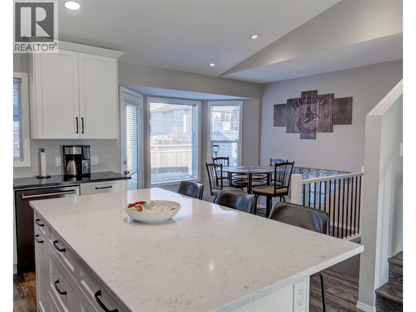 Kitchen Iland bar with quartz counter top - 2312 Hunter Avenue, Armstrong, BC - Indoor