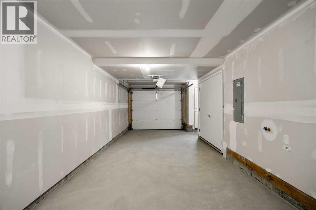 202, 550 Seton Circle Se, Calgary, AB - Indoor Photo Showing Garage