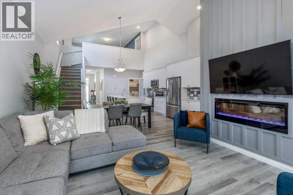 380 Rivercrest View, Cochrane, AB - Indoor Photo Showing Living Room With Fireplace