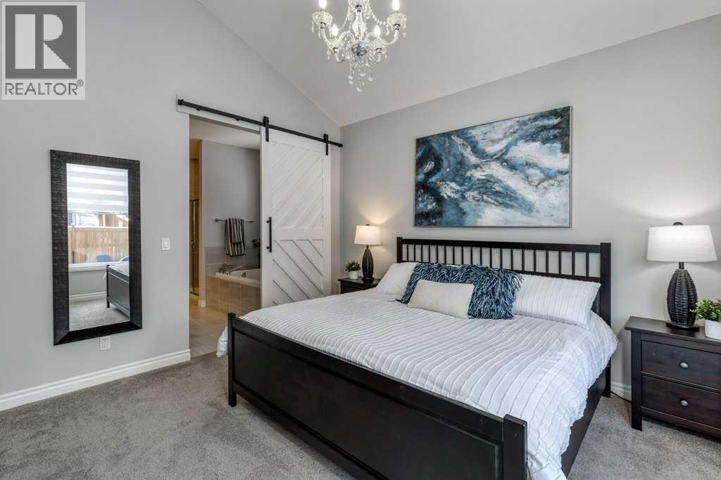 380 Rivercrest View, Cochrane, AB - Indoor Photo Showing Bedroom