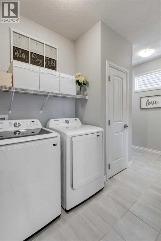 380 Rivercrest View, Cochrane, AB - Indoor Photo Showing Laundry Room