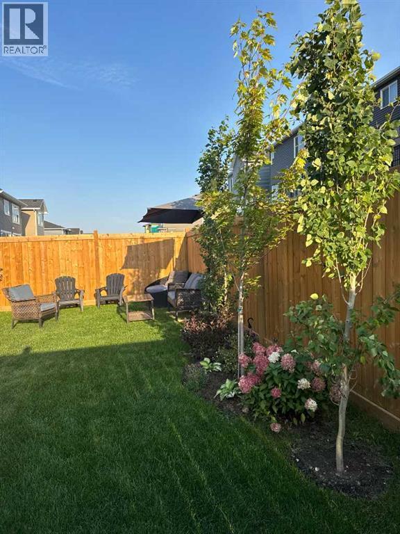 Lots of great trees and shrubs have been planted - 380 Rivercrest View, Cochrane, AB - Outdoor