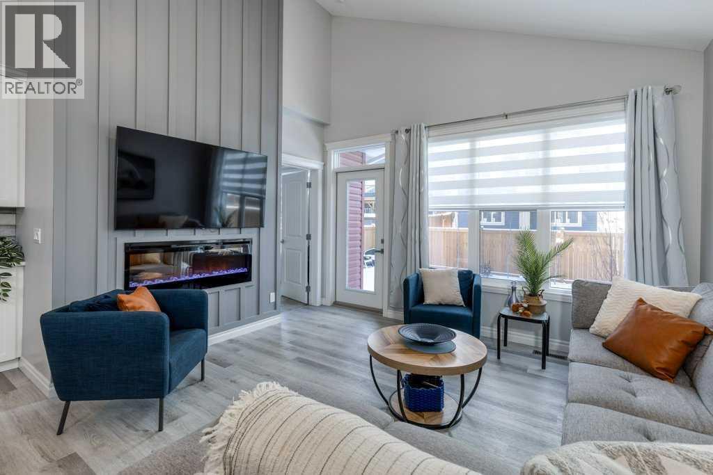 380 Rivercrest View, Cochrane, AB - Indoor Photo Showing Living Room