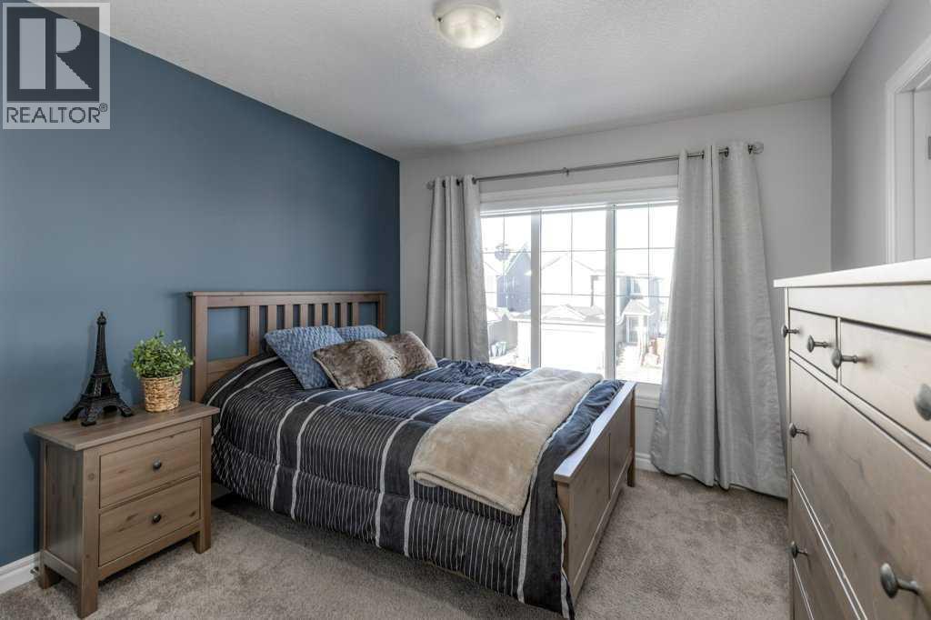 380 Rivercrest View, Cochrane, AB - Indoor Photo Showing Bedroom