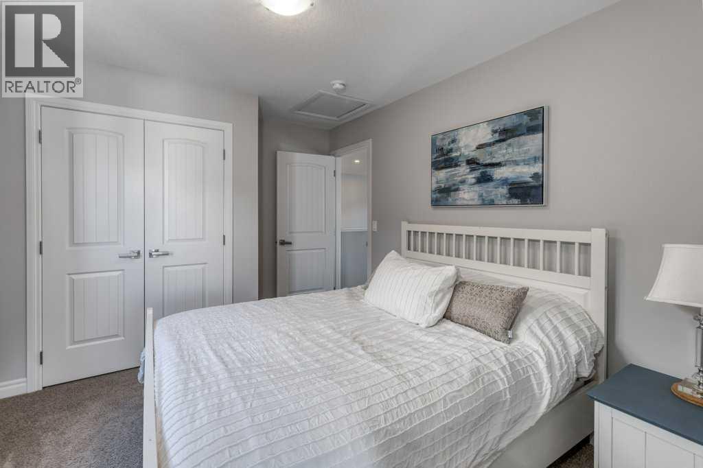 380 Rivercrest View, Cochrane, AB - Indoor Photo Showing Bedroom