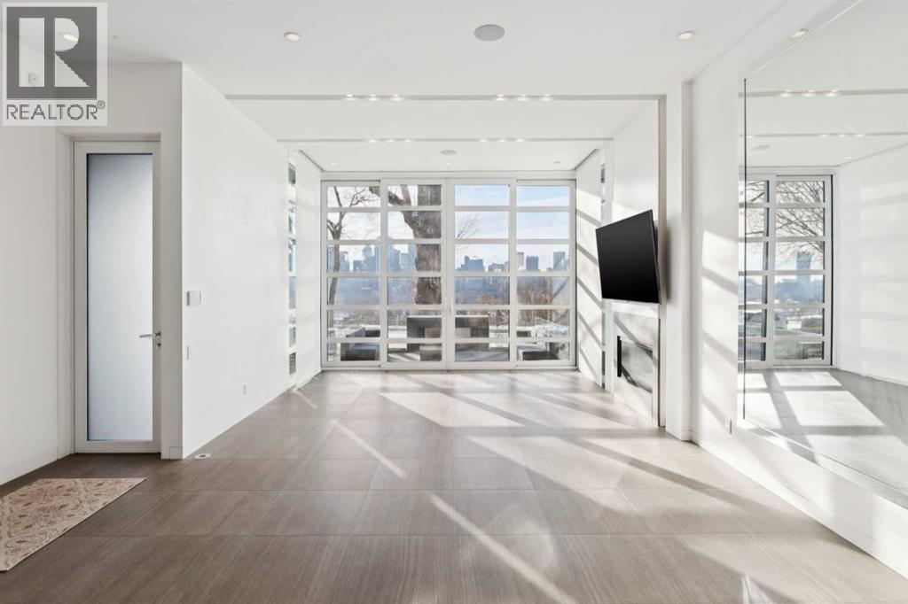 STUNNING VIEWS FROM THE MAIN FLOOR PRINCIPAL ROOMS. HEATED FLOORS THROUGHOUT THE MAIN LEVEL - 530 Crescent Road Nw, Calgary, AB - Indoor Photo Showing Other Room