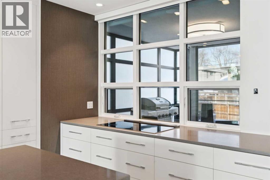 REAR OF THE KITCHEN LOOKS INTO THE "3 SEASON" ROOM - 530 Crescent Road Nw, Calgary, AB - Indoor