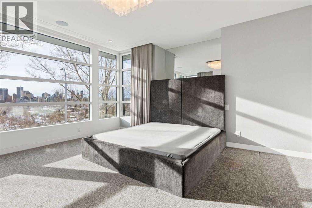 CUSTOM DESIGNER BED FRAME WITH MIRRORED DISPLAY NICHE ABOVE - 530 Crescent Road Nw, Calgary, AB - Indoor Photo Showing Other Room