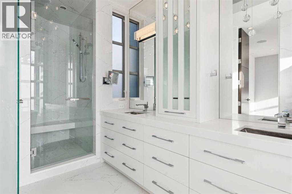 LARGE WALK-IN SHOWER WITH MULTIPLE HEADS AND BENCH. DIFFUSED GLASS WATER CLOSET NOT SHOWN - 530 Crescent Road Nw, Calgary, AB - Indoor Photo Showing Bathroom