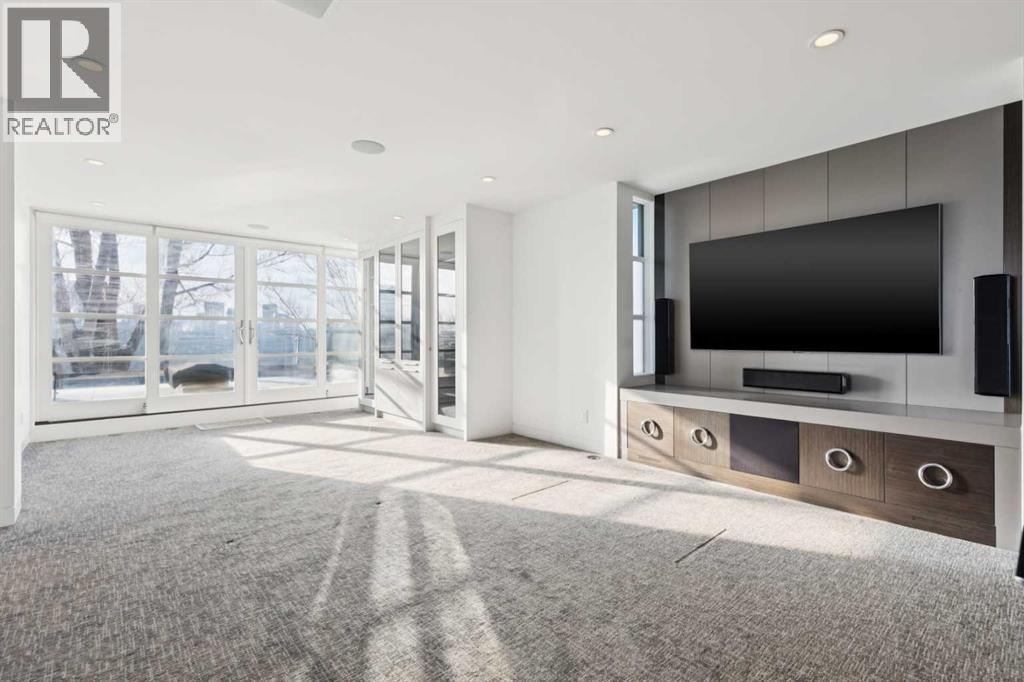 TOP FLOOR MEDIA ROOM AND LOUNGE WITH VIEWS. THEATRE SYSTEM INCLUDED - 530 Crescent Road Nw, Calgary, AB - Indoor