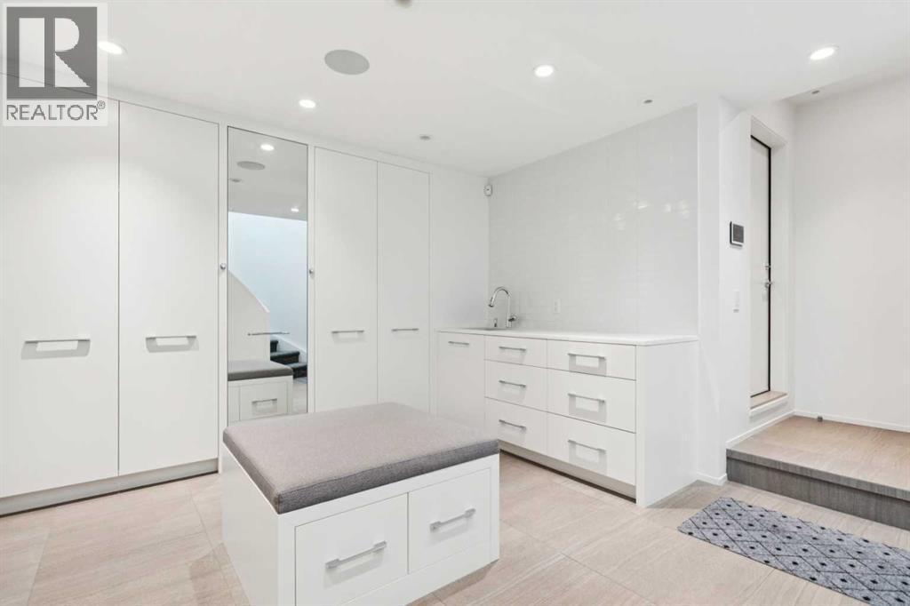 HUGE MUDROOM WITH CENTRE ISLAND, SINK AND AMAZING STORAGE - 530 Crescent Road Nw, Calgary, AB - Indoor Photo Showing Other Room