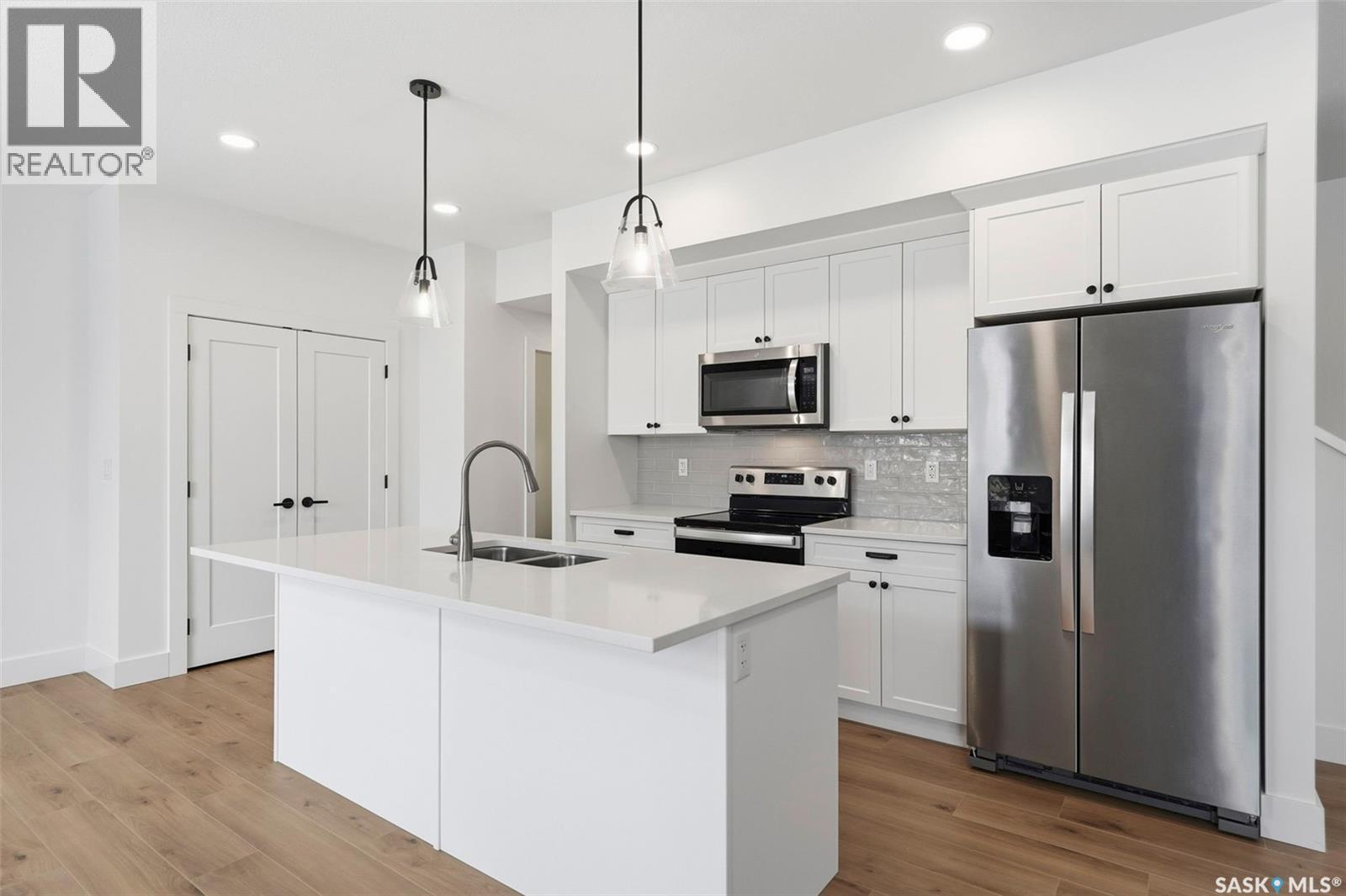 307 Keith Union, Saskatoon, SK - Indoor Photo Showing Kitchen With Stainless Steel Kitchen With Double Sink With Upgraded Kitchen