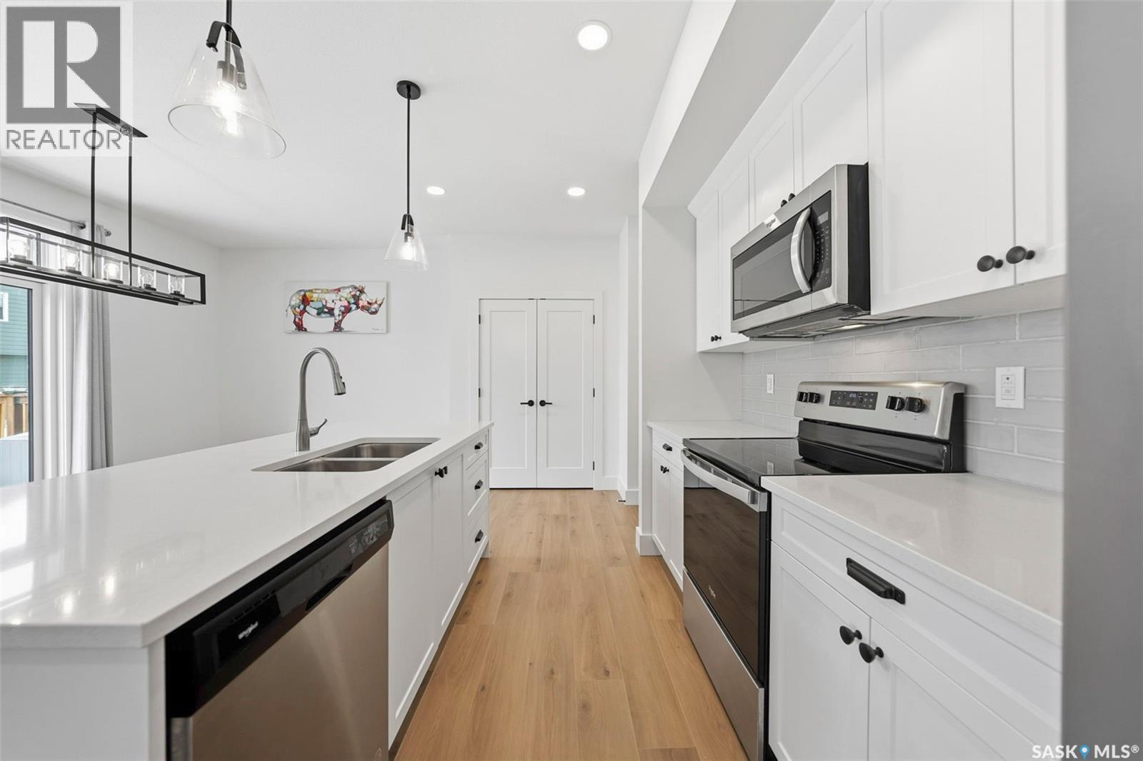 307 Keith Union, Saskatoon, SK - Indoor Photo Showing Kitchen With Stainless Steel Kitchen With Double Sink With Upgraded Kitchen