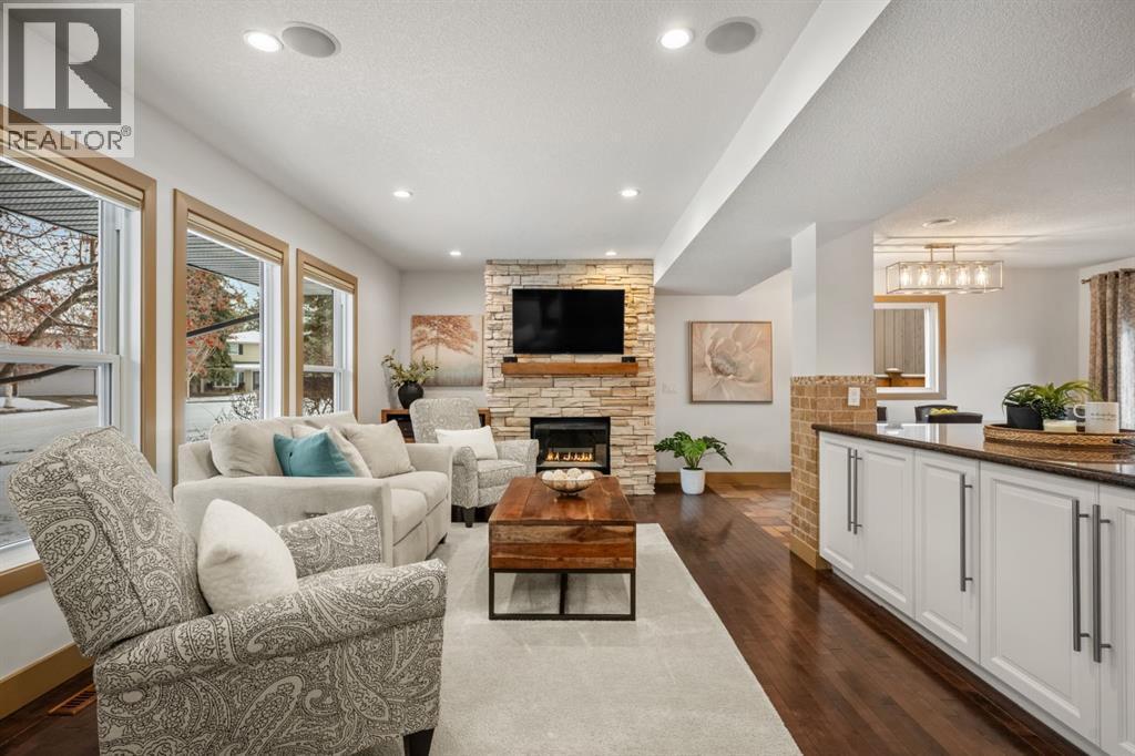 250 Lake Fraser Place Se, Calgary, AB - Indoor Photo Showing Living Room With Fireplace