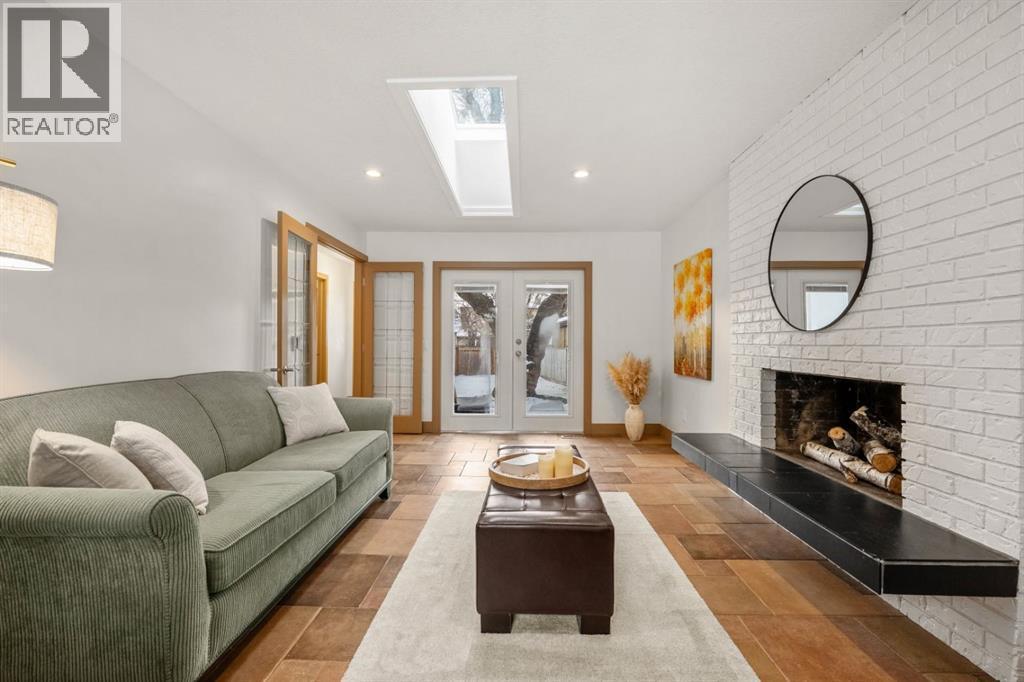 250 Lake Fraser Place Se, Calgary, AB - Indoor Photo Showing Living Room With Fireplace