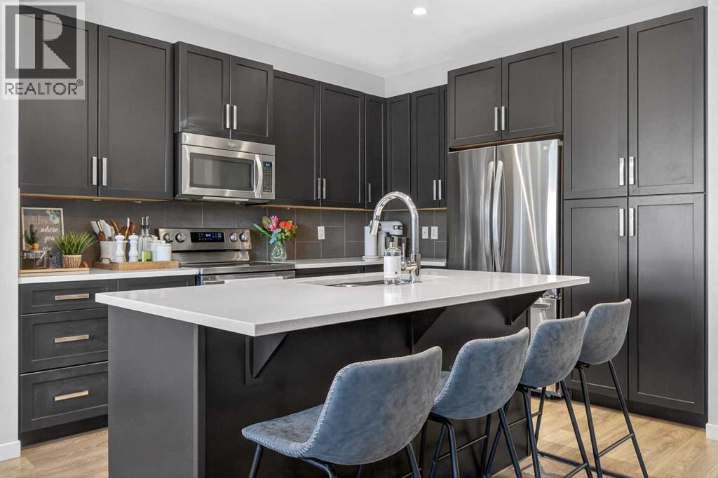 146 Marquis Common Se, Calgary, AB - Indoor Photo Showing Kitchen With Upgraded Kitchen