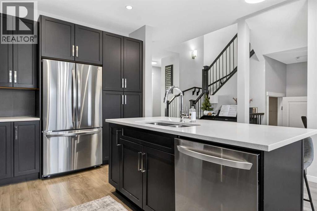 146 Marquis Common Se, Calgary, AB - Indoor Photo Showing Kitchen With Double Sink