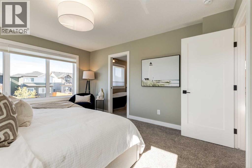 128 Quartz Crescent, Cochrane, AB - Indoor Photo Showing Bedroom