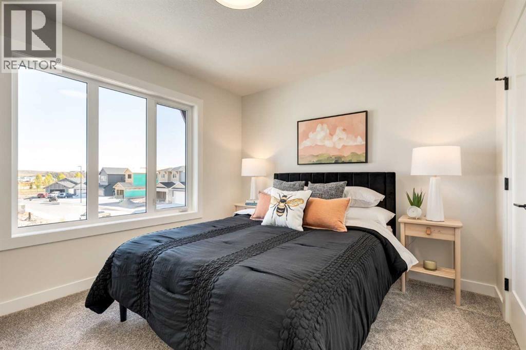 128 Quartz Crescent, Cochrane, AB - Indoor Photo Showing Bedroom
