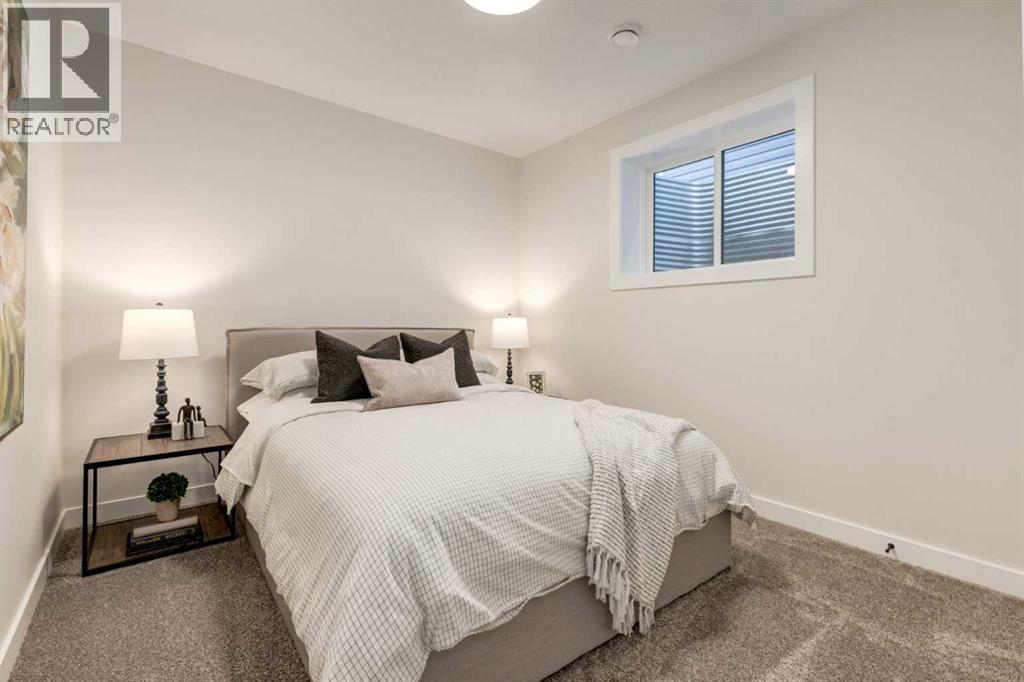 128 Quartz Crescent, Cochrane, AB - Indoor Photo Showing Bedroom