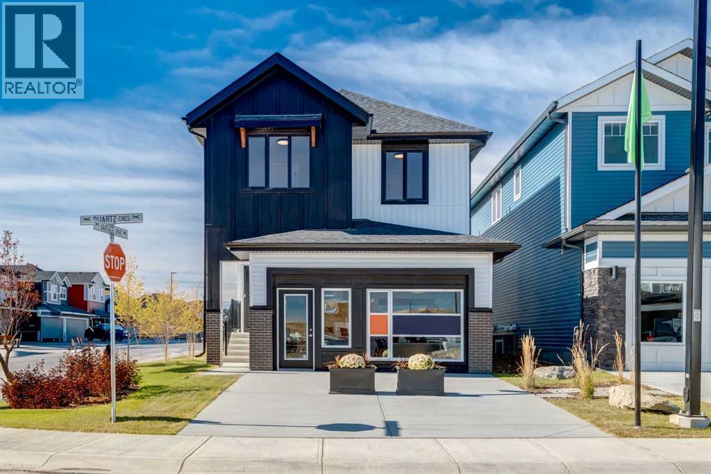 128 Quartz Crescent, Cochrane, AB - Outdoor With Facade