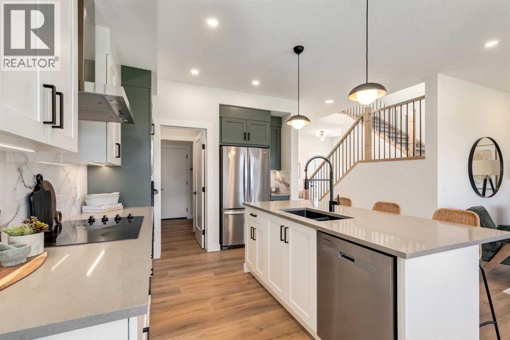 128 Quartz Crescent, Cochrane, AB - Indoor Photo Showing Kitchen With Stainless Steel Kitchen With Double Sink With Upgraded Kitchen