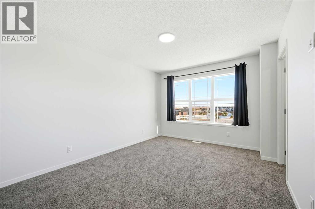 185 Edith Green Nw, Calgary, AB - Indoor Photo Showing Other Room