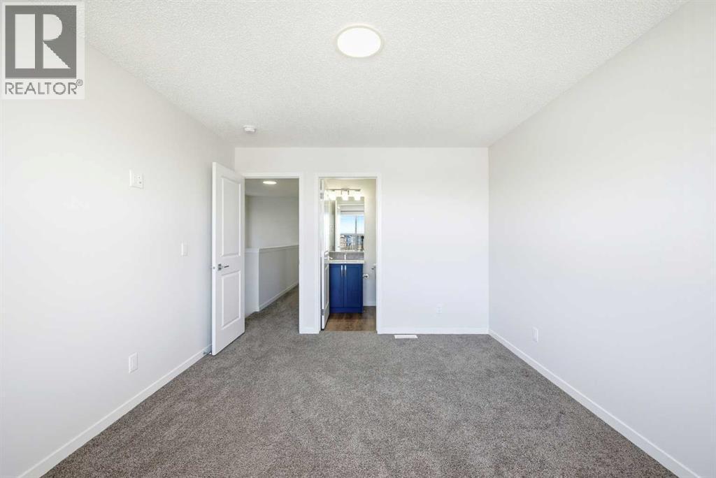 185 Edith Green Nw, Calgary, AB - Indoor Photo Showing Other Room