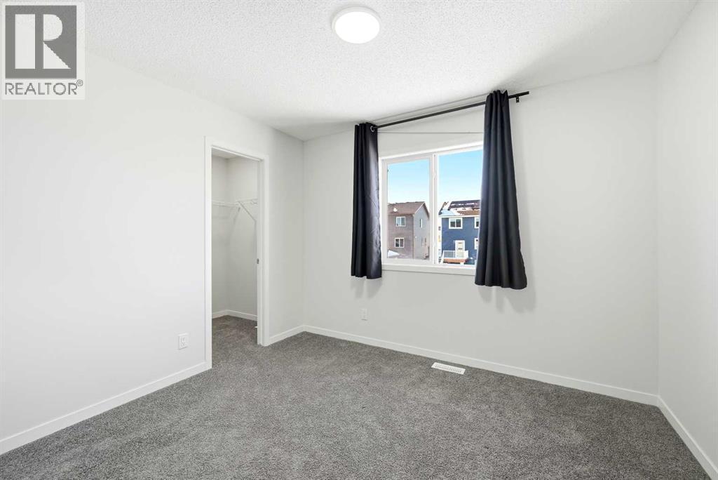185 Edith Green Nw, Calgary, AB - Indoor Photo Showing Other Room