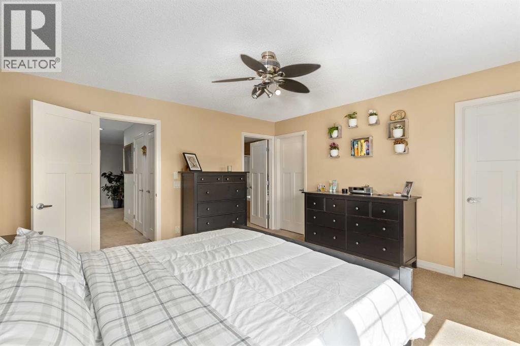 112 Sunset View, Cochrane, AB - Indoor Photo Showing Bedroom