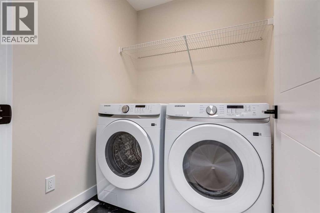 466 River Avenue, Cochrane, AB - Indoor Photo Showing Laundry Room
