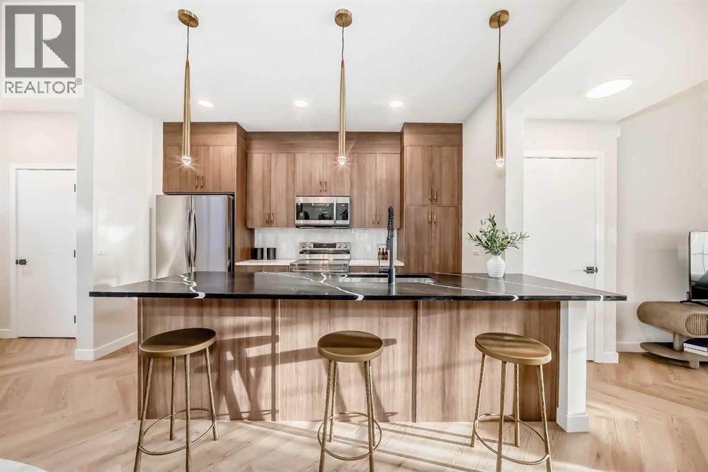 94 Agate Road, Cochrane, AB - Indoor Photo Showing Kitchen With Upgraded Kitchen