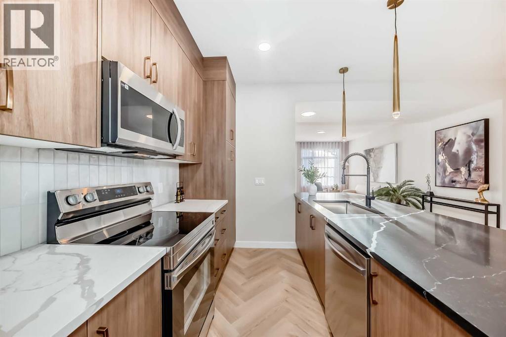 94 Agate Road, Cochrane, AB - Indoor Photo Showing Kitchen With Upgraded Kitchen